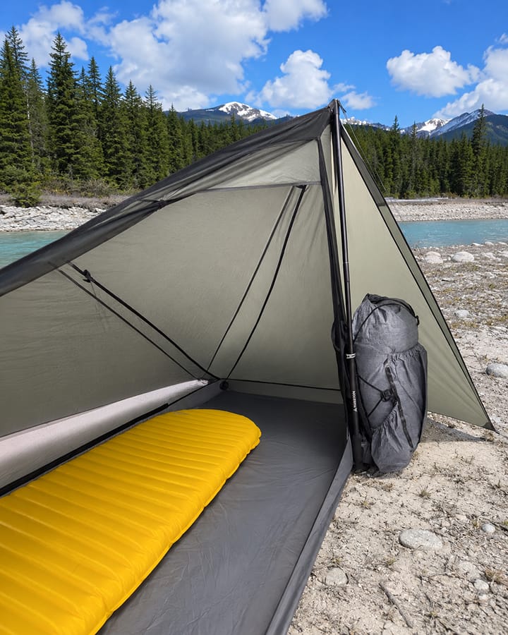 Trekking pole tent interior and pole support at camp