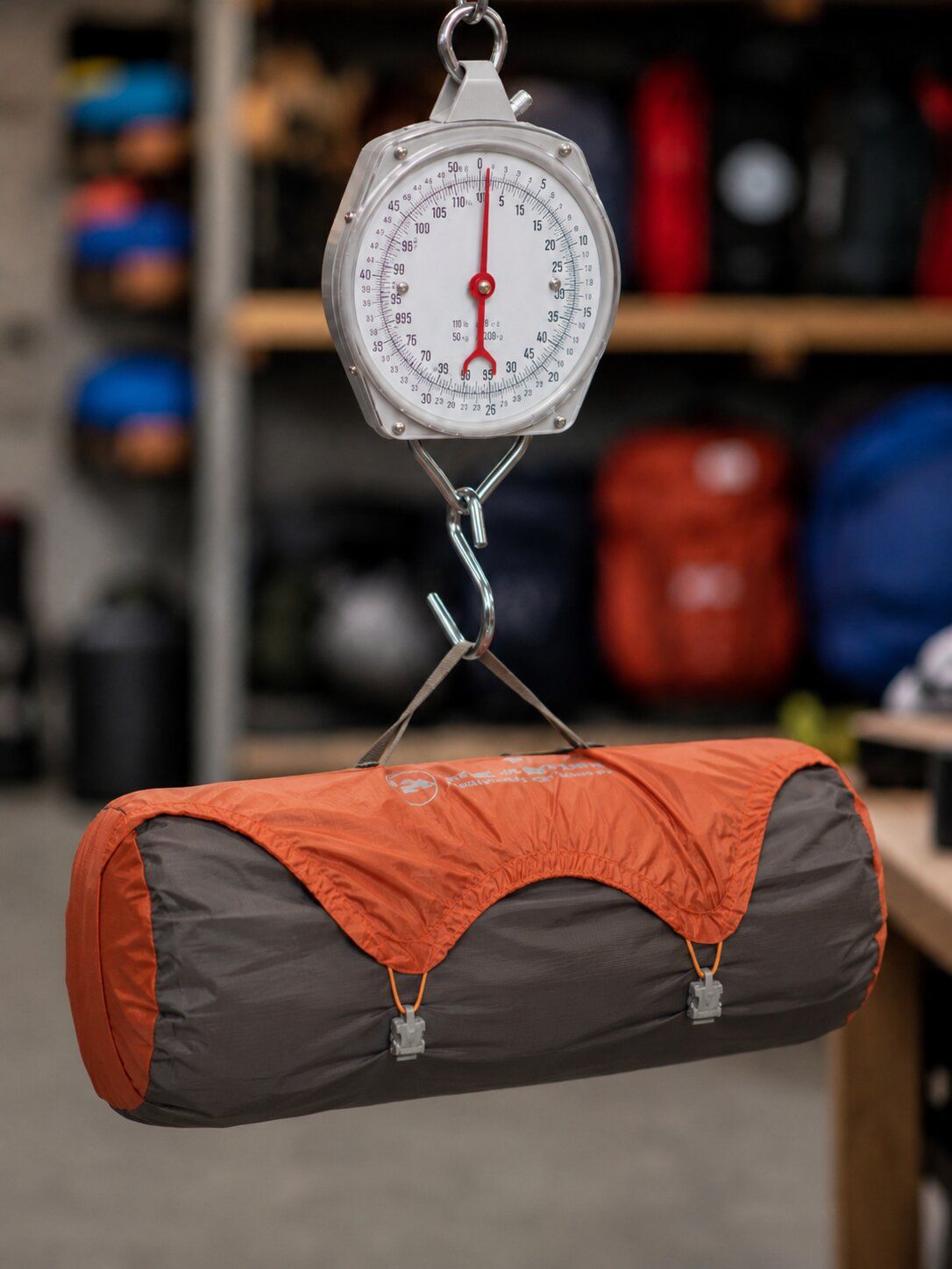 Packed backpacking tent components being weighed